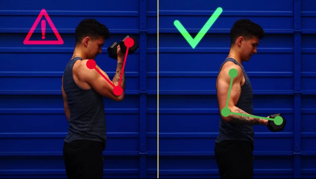 Keep your elbow locked by your side as you perform the standing dumbbell bicep curl during your biceps workout with dumbbells 